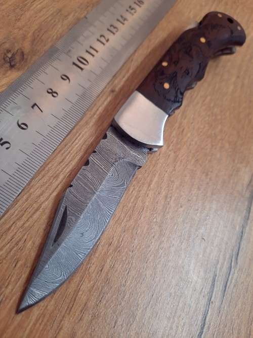 Handmade Damascus steel folding knife w Wooden Handle Scales. Pouch in bad shape, see pictures.