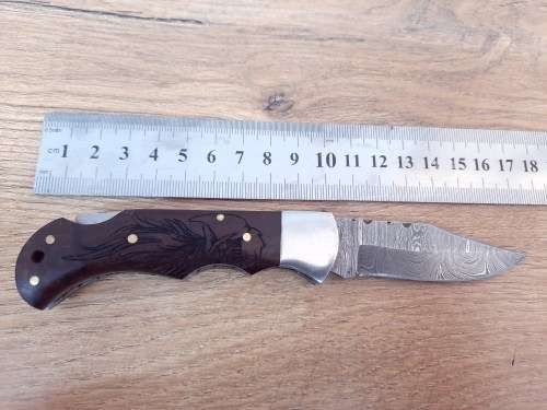 Handmade Damascus steel folding knife w Wooden Handle Scales. Pouch in bad shape, see pictures.