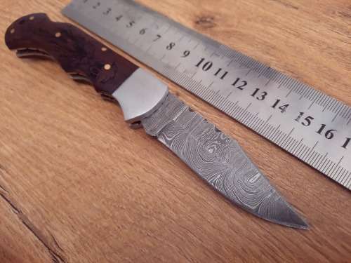 Handmade Damascus steel folding knife w Wooden Handle Scales. Pouch in bad shape, see pictures.