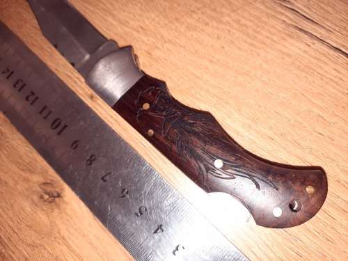 Handmade Damascus steel folding knife w Wooden Handle Scales. Pouch in bad shape, see pictures.
