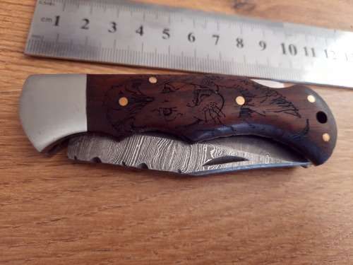 Handmade Damascus steel folding knife w Wooden Handle Scales. Pouch in bad shape, see pictures.