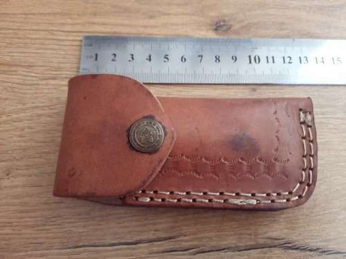 Handmade Damascus steel folding knife w Wooden Handle Scales. Pouch in bad shape, see pictures.