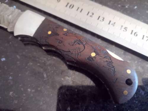 Handmade Damascus steel folding knife w Wooden Handle Scales. Pouch in bad shape, see pictures.