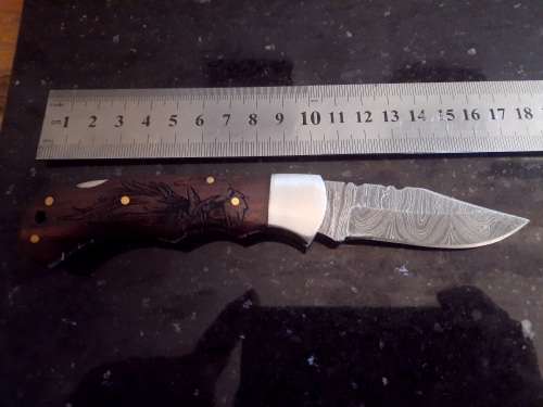 Handmade Damascus steel folding knife w Wooden Handle Scales. Pouch in bad shape, see pictures.