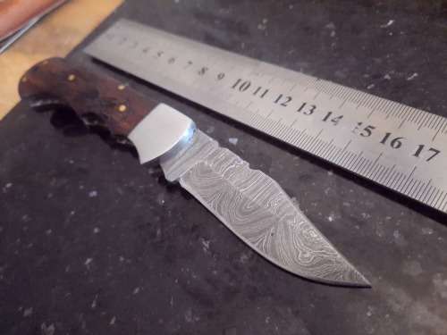 Handmade Damascus steel folding knife w Wooden Handle Scales. Pouch in bad shape, see pictures.