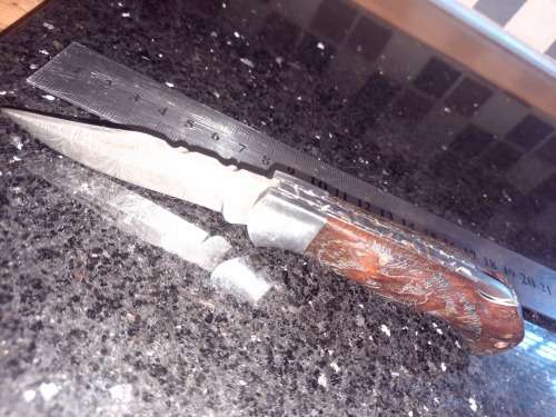 Handmade Damascus steel folding knife w Wooden Handle Scales. Pouch in bad shape, see pictures.