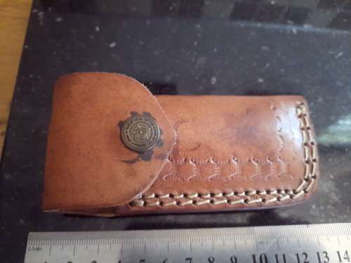 Handmade Damascus steel folding knife w Wooden Handle Scales. Pouch in bad shape, see pictures.