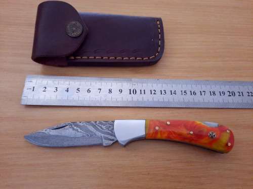 Handmade Damascus steel folding knife w Epoxy Resin Handle Scales. Exact knife you will receive.