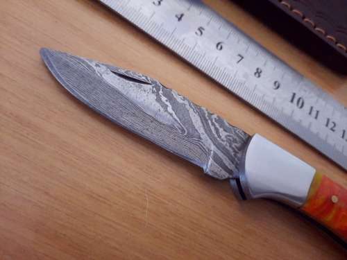 Handmade Damascus steel folding knife w Epoxy Resin Handle Scales. Exact knife you will receive.