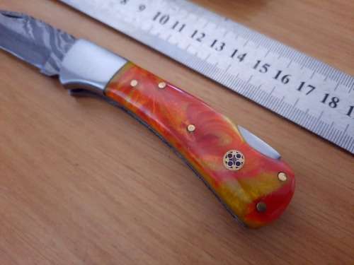 Handmade Damascus steel folding knife w Epoxy Resin Handle Scales. Exact knife you will receive.