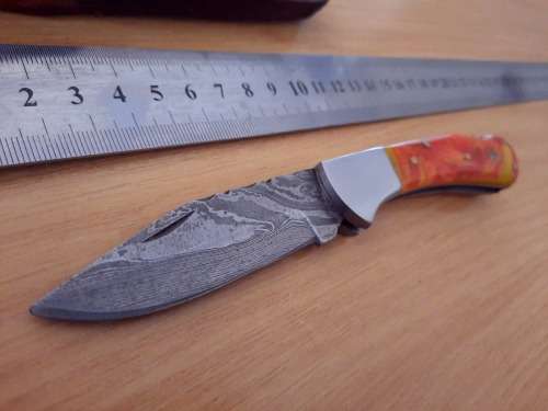 Handmade Damascus steel folding knife w Epoxy Resin Handle Scales. Exact knife you will receive.