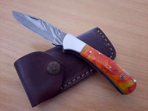 Handmade Damascus steel folding knife w Epoxy Resin Handle Scales. Exact knife you will receive.