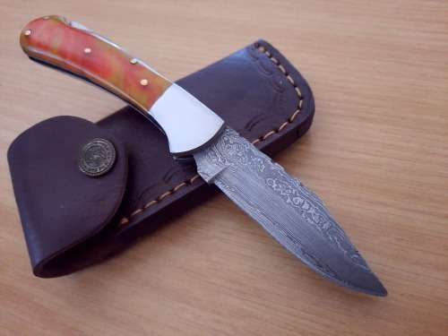 Handmade Damascus steel folding knife w Epoxy Resin Handle Scales. Exact knife you will receive.