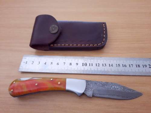 Handmade Damascus steel folding knife w Epoxy Resin Handle Scales. Exact knife you will receive.