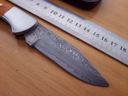 Handmade Damascus steel folding knife w Epoxy Resin Handle Scales. Exact knife you will receive.