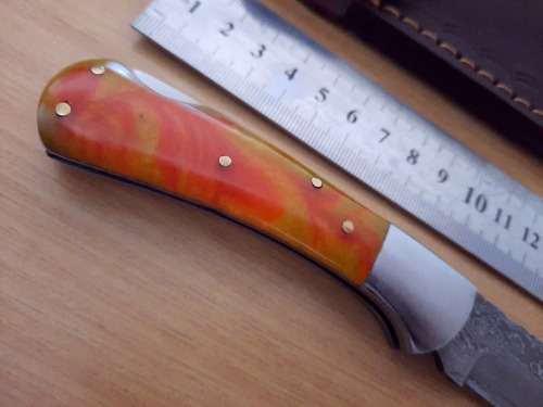 Handmade Damascus steel folding knife w Epoxy Resin Handle Scales. Exact knife you will receive.