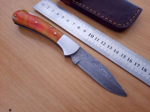Handmade Damascus steel folding knife w Epoxy Resin Handle Scales. Exact knife you will receive.