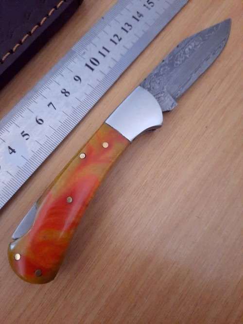 Handmade Damascus steel folding knife w Epoxy Resin Handle Scales. Exact knife you will receive.