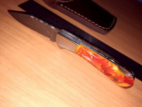 Handmade Damascus steel folding knife w Epoxy Resin Handle Scales. Exact knife you will receive.