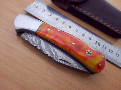Handmade Damascus steel folding knife w Epoxy Resin Handle Scales. Exact knife you will receive.