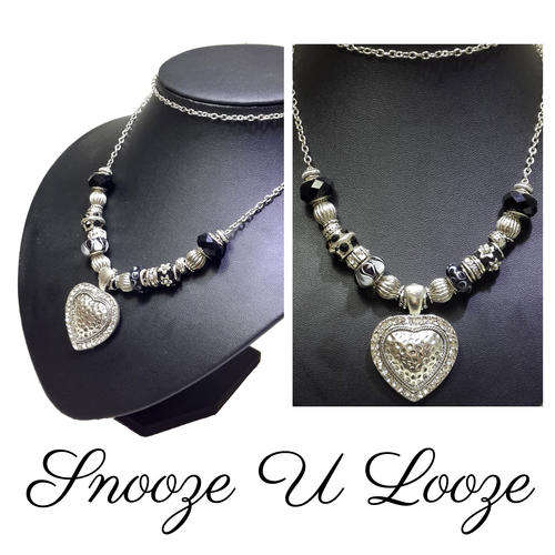 An elegant  handmade necklace with Pandora beads, and an exquisite Heart  pendant.