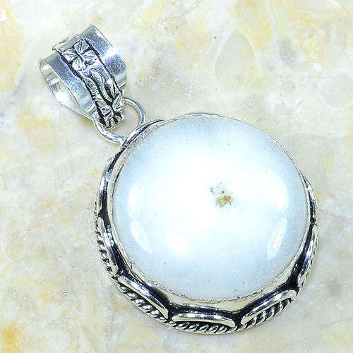 WHITE SOLAR QUARTZ SET IN STERLING SILVER