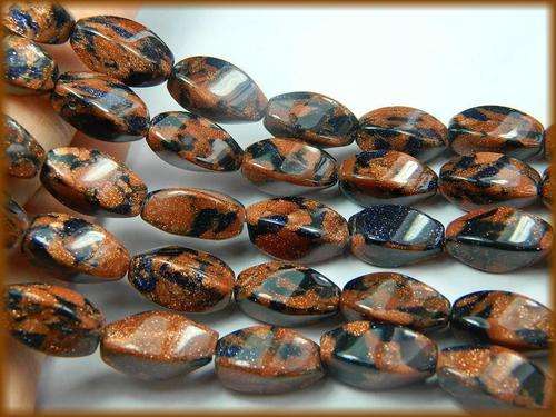 GOLD AND BLUE SUN SITARA 8MM TWISTED OBLONG LOOSE GEMS  25 PIECES