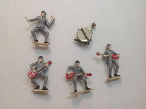 The Beatles LPs and set of figurines collection.