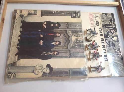 The Beatles LPs and set of figurines collection.