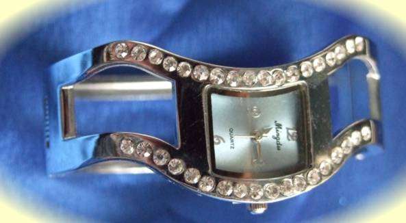 LOVELY DESIGNER SWERVE QUARTZ  WATCH STUDDED WITH CRYSTALS