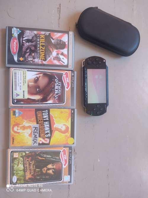 PSP Console + 4 games + carry case