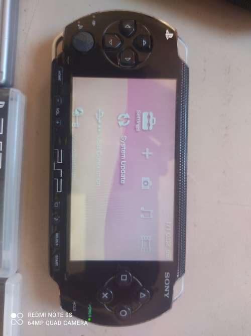 PSP Console + 4 games + carry case