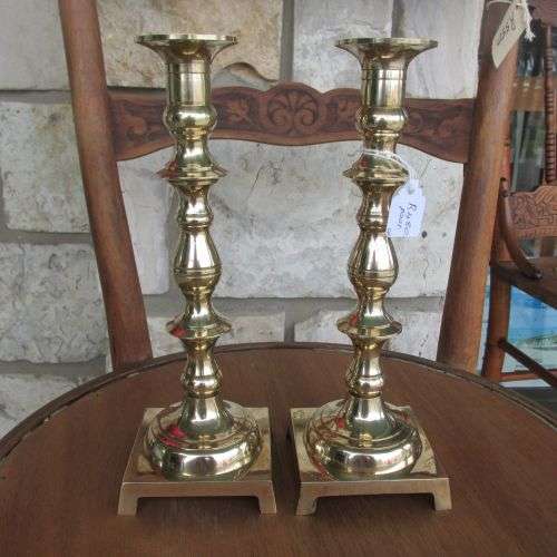 A PAIR OF TWO SOLID BRASS CANDLE STICKS