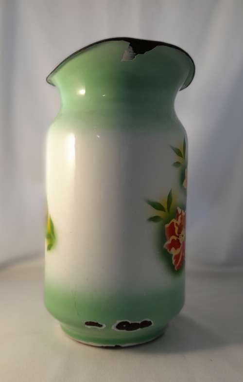 VINTAGE GREEN ENAMEL JUG WITH FLOWER DETAIL  31 CM TALL