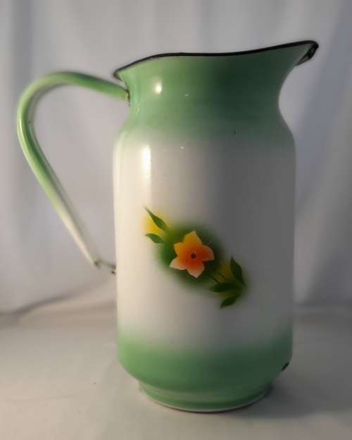 VINTAGE GREEN ENAMEL JUG WITH FLOWER DETAIL  31 CM TALL