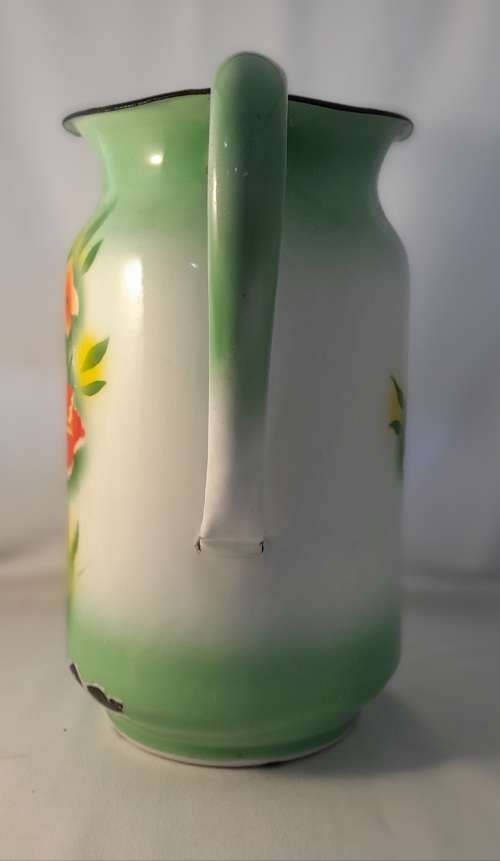VINTAGE GREEN ENAMEL JUG WITH FLOWER DETAIL  31 CM TALL