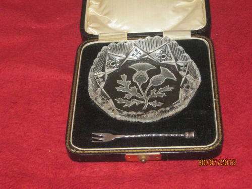 A boxed Scottish Crystal Canape/Pickle dish with a matching Hallmarked Silver Fork
