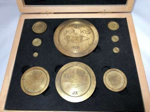 Vintage brass bullion weights in wooden box