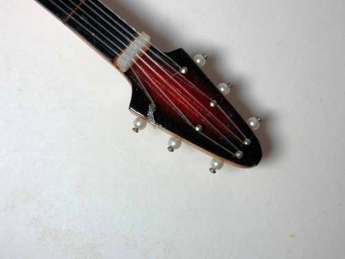 MINIATURE TOY REPLICA OF THE GIBSON FLYING V ELECTRICAL GUITAR