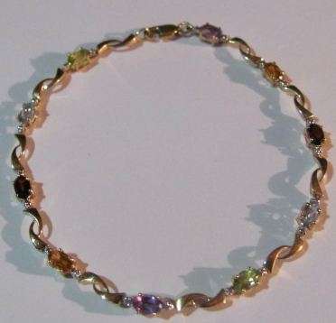 Stunning 9ct gold gemstone bracelet with  valuation certificate