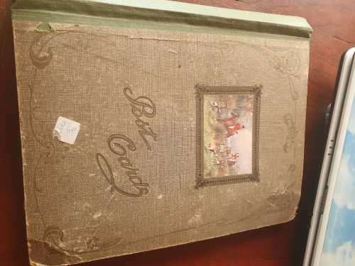 Vintage postcard album with 67 postcards