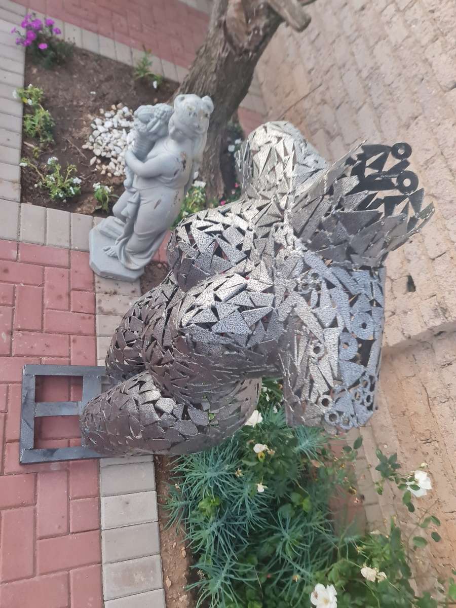 Hand Crafted Metal Female Torso Sculpture With a Metal Base