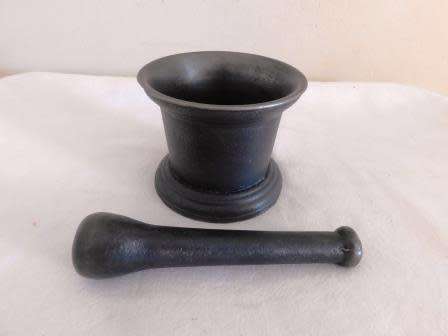 A KENRICK & SONS CAST IRON MORTAR AND PESTLE