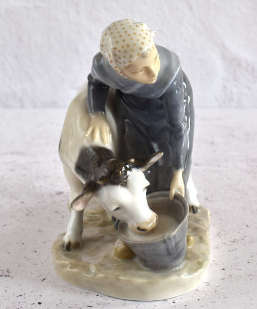 Royal Copenhagen Milkmaid Feeding Cow Figure