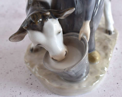 Royal Copenhagen Milkmaid Feeding Cow Figure
