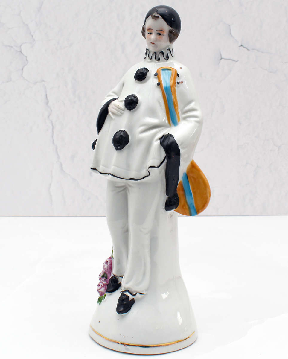 30s romantic Pierrot figurine holding a mandolin