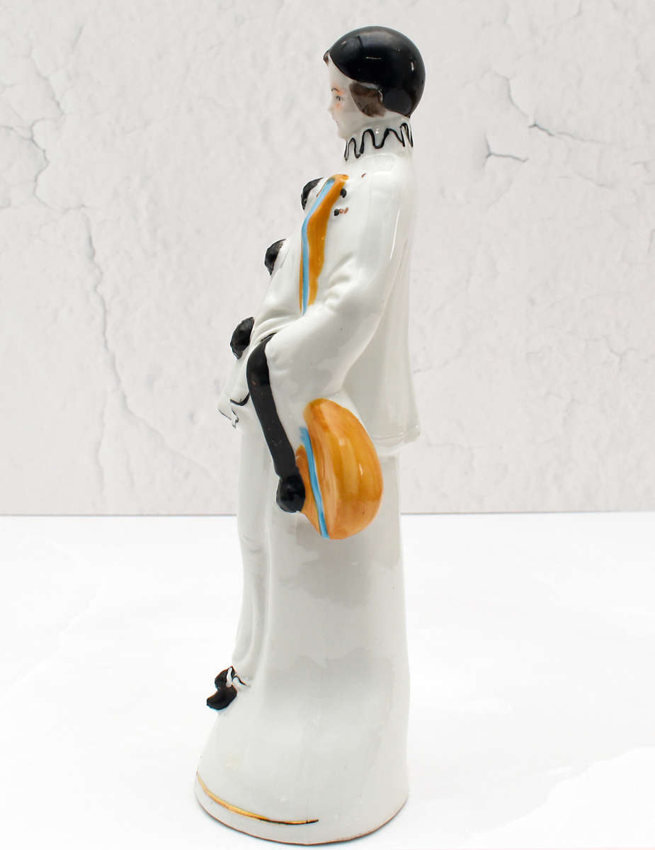 30s romantic Pierrot figurine holding a mandolin