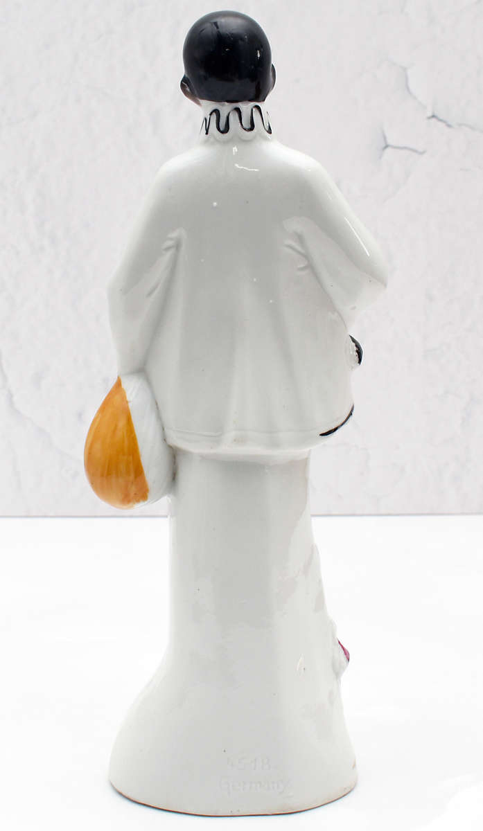 30s romantic Pierrot figurine holding a mandolin
