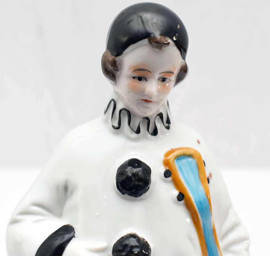 30s romantic Pierrot figurine holding a mandolin