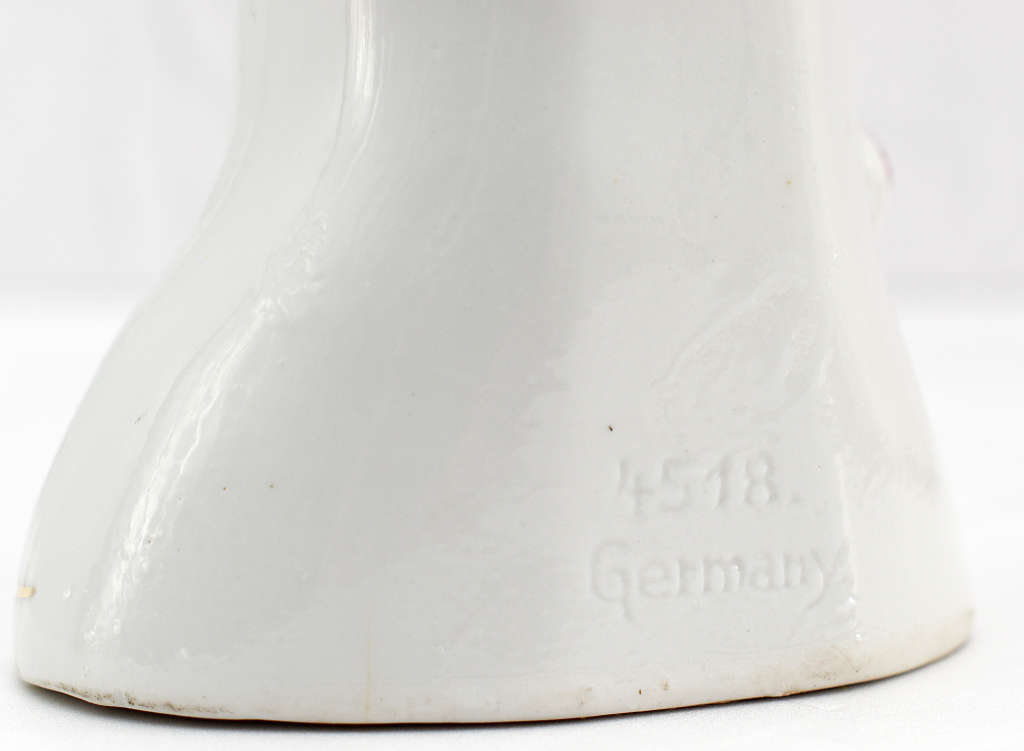 30s romantic Pierrot figurine holding a mandolin